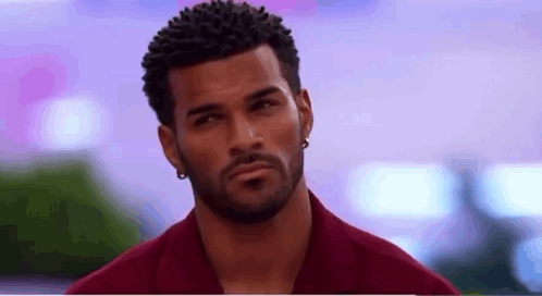 Man With Beard in Red Shirt and Earrings