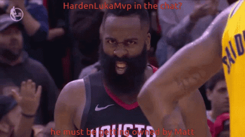 Man with Beard in Rockets Jersey Looks Angry