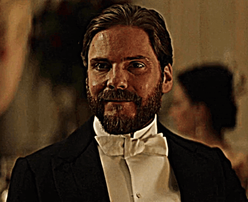 Man With Beard In Suit And Tie Looking Out Window GIF