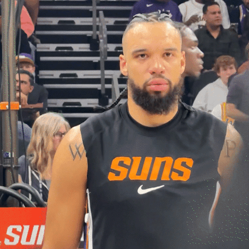 Man with Beard in Suns Jersey