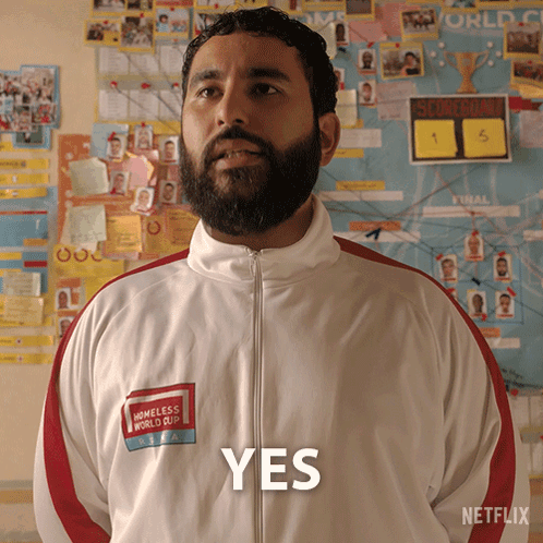Man with Beard in White Jacket Saying Yes