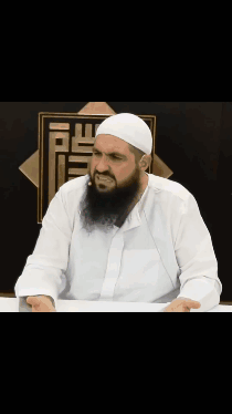 Man with Beard in White Shirt and Hat