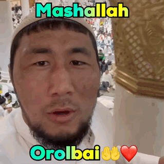 Man With Beard In White Shirt And Hat Says Mashallah Orolbai GIF
