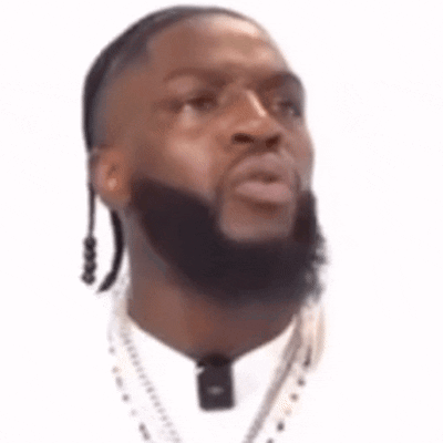 Man with Beard in White Shirt and Necklace