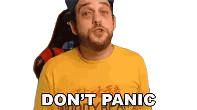 Man with Beard in Yellow Shirt Saying Dont Panic