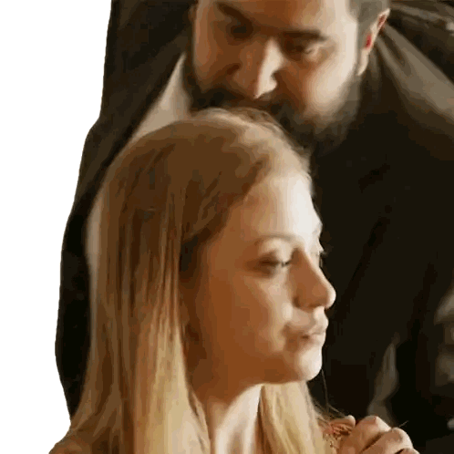 Man with Beard Kissing Woman's Forehead