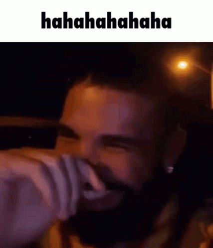 Man With Beard Laughing Covering Face
