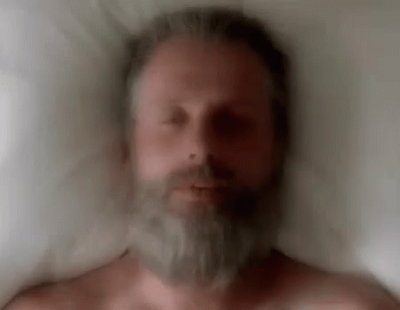 Man With Beard Laying in Bed