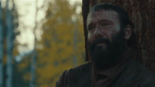 Man With Beard Leaning Against Tree Eyes Closed
