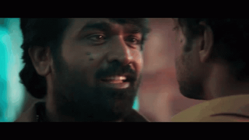 Man With Beard Looking at Another Man