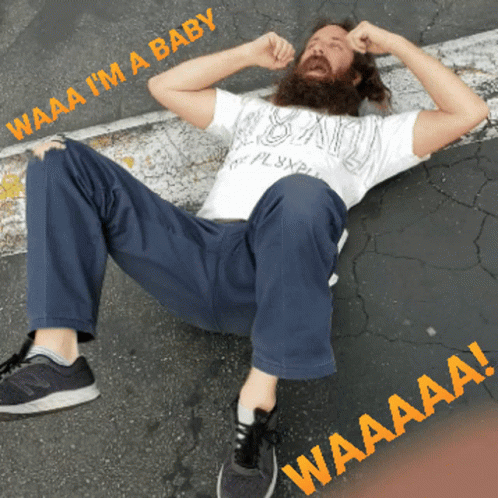 Man with Beard Lying Down Waaa Waaa I Am a Baby