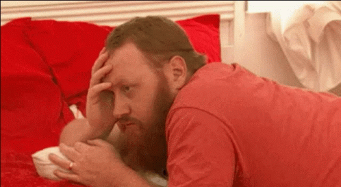 Man with Beard Lying on Bed