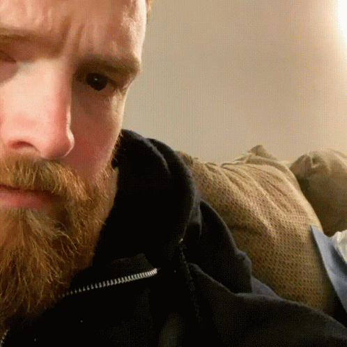 Man with Beard Lying on Couch