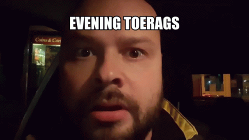 Man with Beard Making Funny Face Evening Toerags