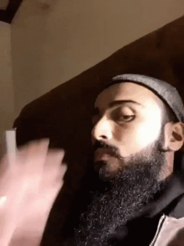 Man With Beard Mustache Hat Sitting On Couch GIF