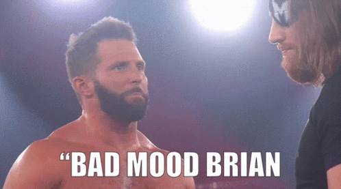 Man with Beard Next to Bad Mood Brian