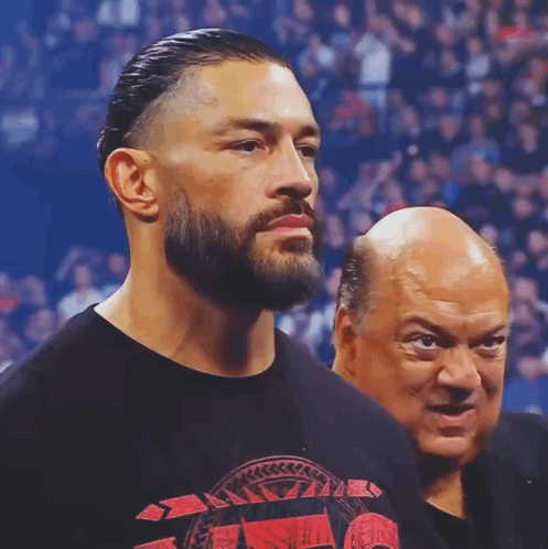 Man With Beard Next To Bald Man In Black Shirt GIF
