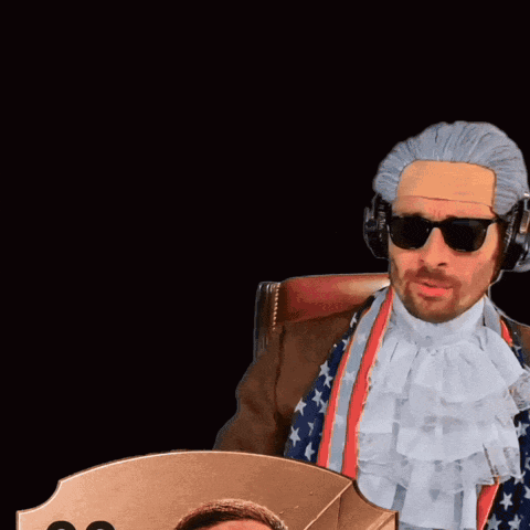 Man With Beard Next to Card Saying 00 GK USA