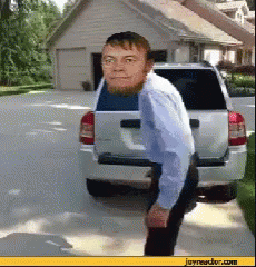 Man With Beard Next To Silver SUV GIF