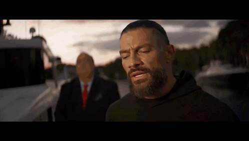 Man With Beard Next To Suit GIF