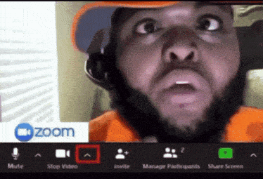 Man with Beard on Video Call with Zoom Logo