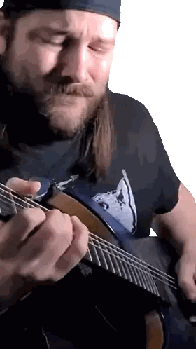 Man With Beard Playing Guitar