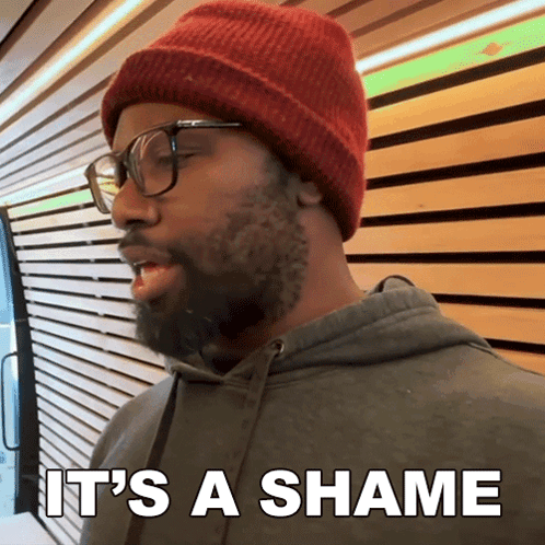 Man with Beard Red Beanie and Glasses Says Shame