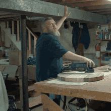 Man With Beard Sanding Wood