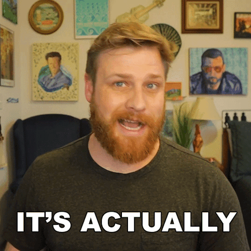 Man With Beard Saying It's Actually In Front of Pictures