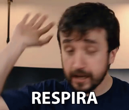 Man With Beard Saying Respira With Hand