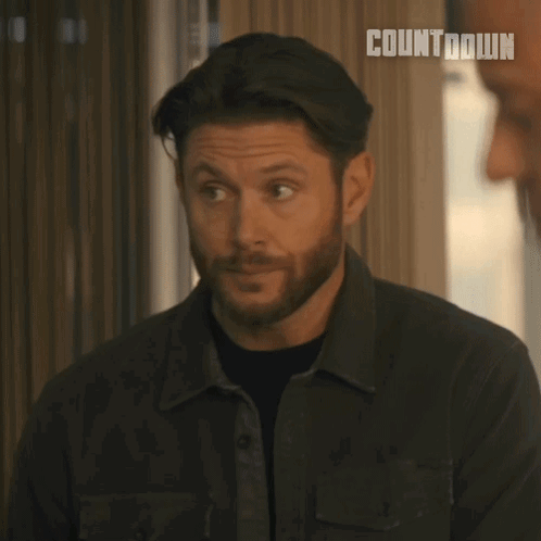 Man With Beard Says Please Continue in Front of Window