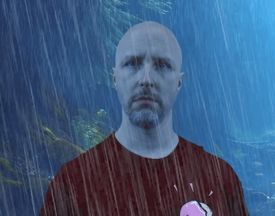 Man With Beard Shaving Head in Mirror