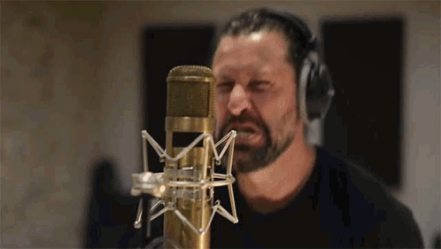 Man With Beard Singing Into Microphone GIF