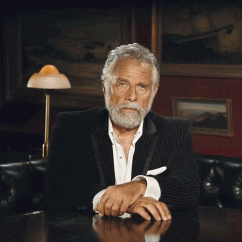 Man With Beard Sitting at Table