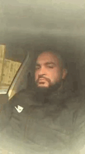 Man With Beard Sitting in Car