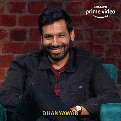 Man With Beard Sitting in Chair Dhanyawad