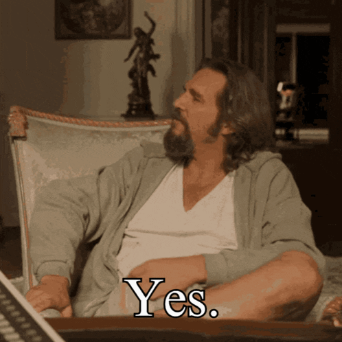 Man with Beard Sitting in Chair Yes