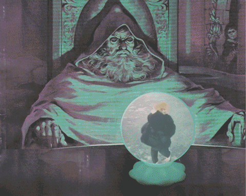 Man With Beard Sitting In Front Of Glass Ball GIF