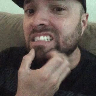 Man with Beard Sitting on Couch
