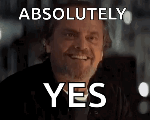 Man with Beard Smiling at Absolutely Yes Sign