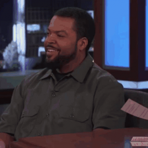 Man With Beard Smiling At Desk GIF