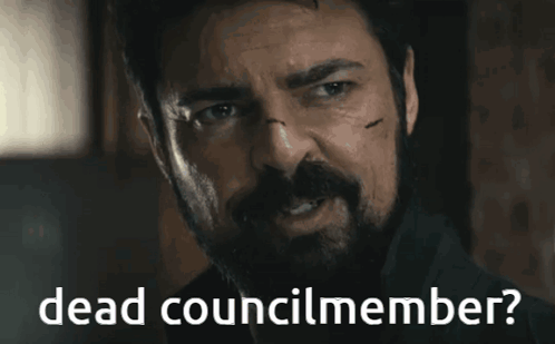 Man With Beard Smiling Dead Councilmember