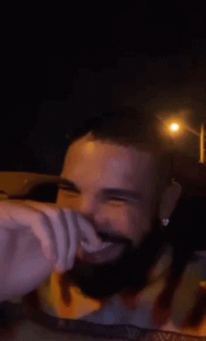 Man With Beard Smiling Driving Car