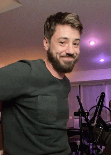 Man With Beard Smiling In Green Shirt GIF