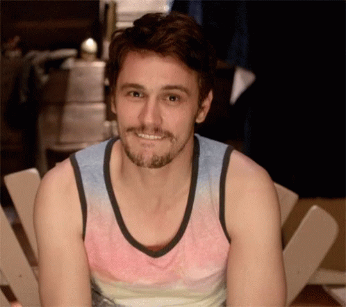 Man with Beard Smiling in Tank Top