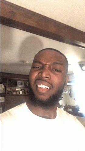 Man With Beard Smiling Making Face