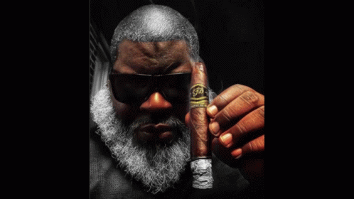 Man with Beard Smoking Blue Cigar