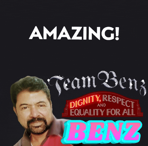 Man With Beard Standing Before Amazing Team Benz Sign
