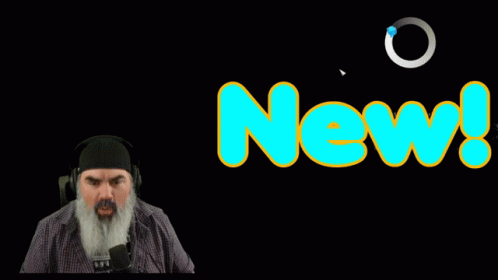 Man with Beard Standing Before New Sign