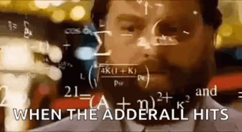 Man With Beard Standing In Front Of Chalkboard GIF